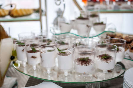 Sweet cakes at a wedding buffet. Cateringの写真素材