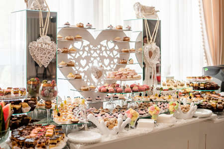 Sweet cakes at a wedding buffet. Cateringの写真素材