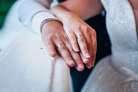 hands of newlyweds with wedding ringsの写真素材