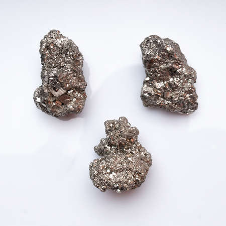 Natural mineral pyrite on white backgroundの写真素材