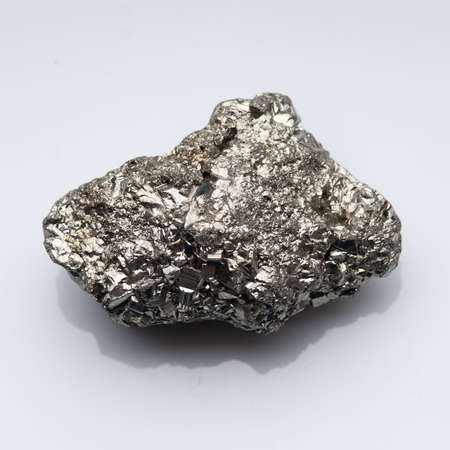 Natural mineral pyrite on white backgroundの写真素材