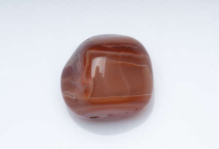 Natural stone carnelian on a white background