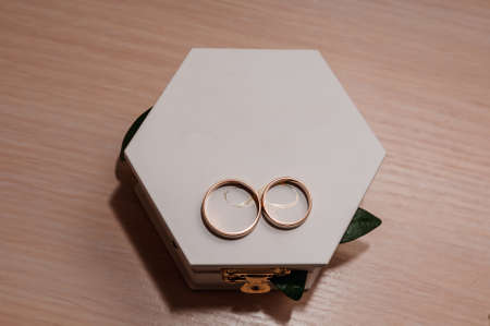 Wedding gold rings on white box