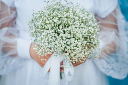 Bouquet of flowers in the hand of the brideの写真素材