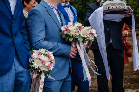 Bouquet of flowers in the groom's handの写真素材