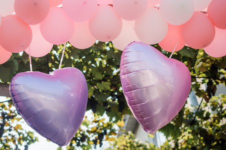 Decor with balloons for the holiday. White and pink heart shaped balloonsの写真素材