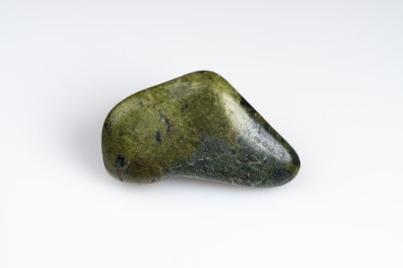 Natural stone green serpentine on a white background