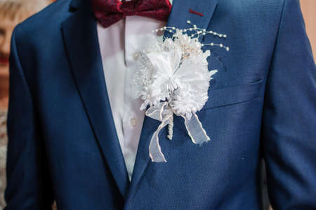 Boutonniere on the groom's jacketの写真素材