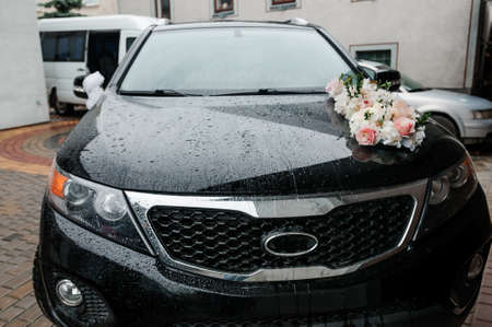 Car decoration for a wedding. Decorations on the car of the newlyweds. Cortege at the weddingの写真素材
