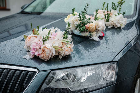 Car decoration for a wedding. Decorations on the car of the newlyweds. Cortege at the weddingの写真素材