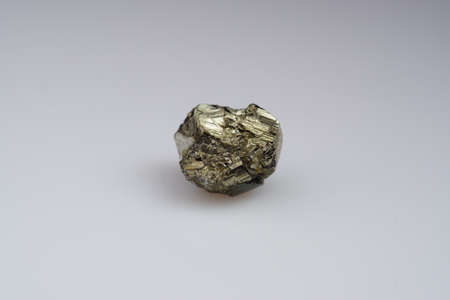 Natural gemstone pyrite on white backgroundの写真素材