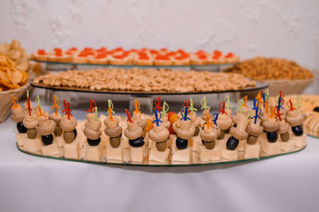 Canapes with cheese, mushrooms and olivesの写真素材