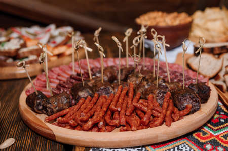 Slicing different types of meat. Wedding buffetの写真素材