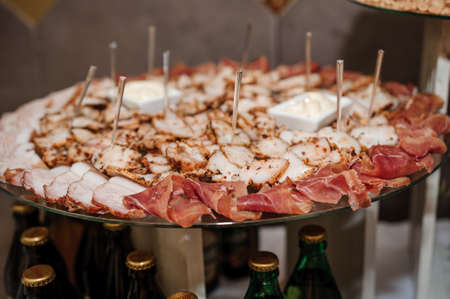 Slicing different types of meat. Wedding buffetの写真素材