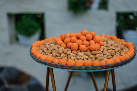 Nuts of different varieties. Peanuts, pistachios, cashews. Wedding buffet. Beer snack. Beer table