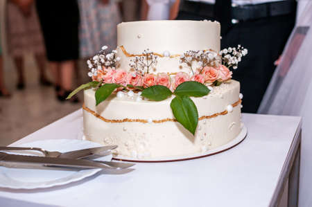 Beautiful wedding cake decorated with flowers, cake close up and blur backgroundの写真素材