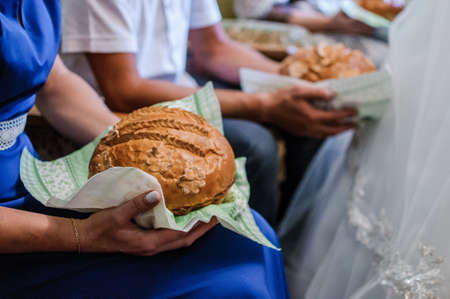 Wedding bread decorated with flowers and leaves with doughの写真素材