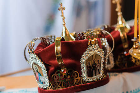 Traditional wedding crowns in a church. Wedding crown in church ready for marriage ceremonyの写真素材