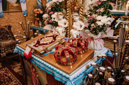 Traditional wedding crowns in a church. Wedding crown in church ready for marriage ceremonyの写真素材