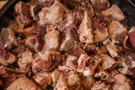 Fried veal liver in a pan. Braised cow and pork liverの写真素材