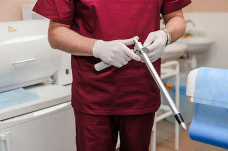 Anoscopes with ring lights in the hands of a doctorの写真素材