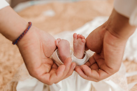 little baby feet baby on fathers arm