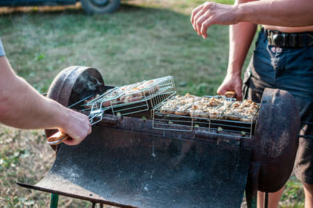 grilled meat skewers chicken the meat holder over fire burned churcoal
