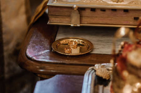 Traditional wedding crowns in a church. Wedding crown in church ready for marriage ceremonyの写真素材