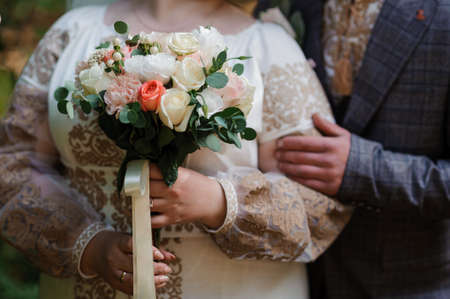 Bouquet of flowers in the brides hand. Bridal bouquet