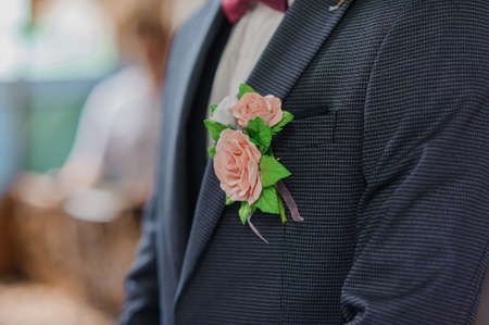 Boutonniere on the grooms jacketの写真素材