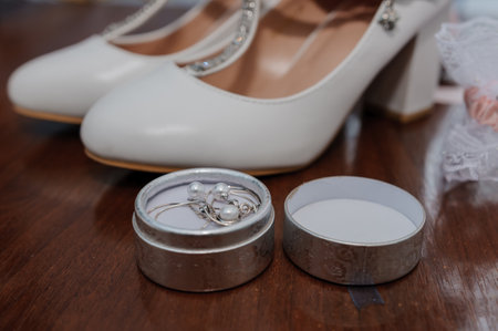 Brides accessories. Womens shoes leather, garter, bridal bouquet, candles, pendant