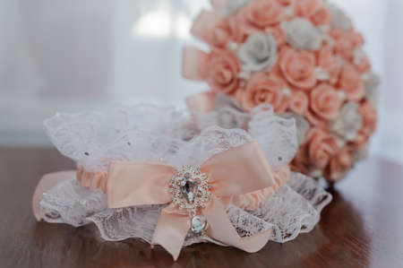 Bride's garter on the bride's leg. Garter on the girl's legの写真素材