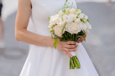 Bouquet of flowers in the hand of the bride. Wedding