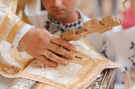 The groom holds the bride's hand. The guy holds the girl's hand. Weddingの写真素材