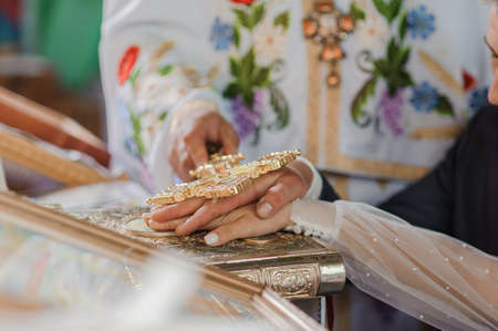 wedding ceremony in the church. Hands of the bride and groomの写真素材