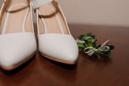 White shoes, groom's boutonniere. Bride morning, wedding accessoriesの写真素材