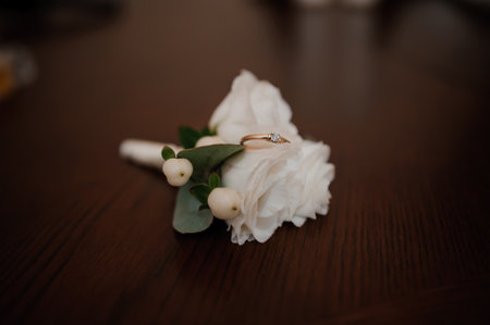 Groom's boutonniere with white flowers on background