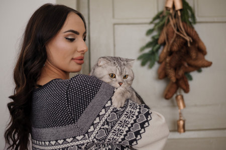 Gray cat in the arms of a pregnant womanの写真素材