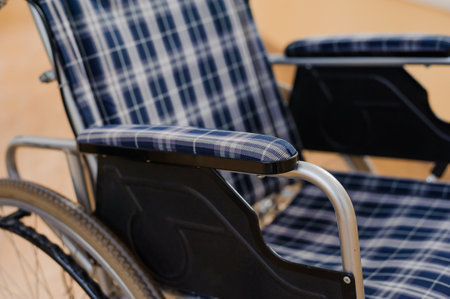 Children's wheelchair. Empty wheelchair in the hospitalの写真素材