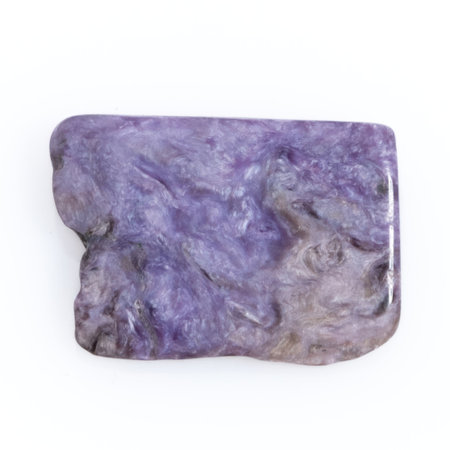 Natural gem purple charoite isolated on white backgroundの写真素材