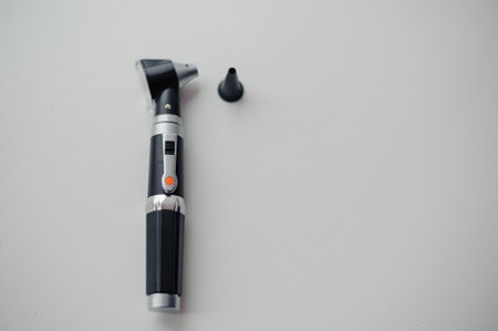 Otoscope on a background. Instrument for examining the auricle and middle earの写真素材