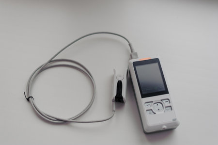 Pulse oximeter on a background. Medical control and diagnostic device for measuring the saturation of capillary blood with oxygenの写真素材