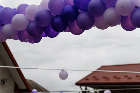 Wedding arch made of colorful balloons. Children's holiday celebration. purple balloonsの写真素材
