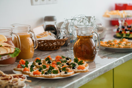 Canapes with salmon, cream cheese and greens. Festive buffetの写真素材