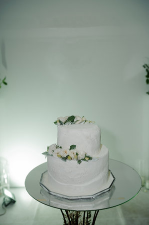 Beautiful wedding cake decorated with flowers, cake close-up and blurred background