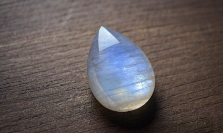 Natural precious moonstone on a brown background. Natural stone adulariaの写真素材