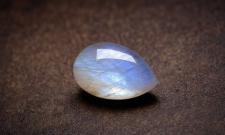Natural precious moonstone on a brown background. Natural stone adulariaの写真素材