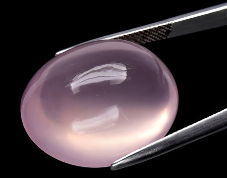 natural pink rose quartz gem on background