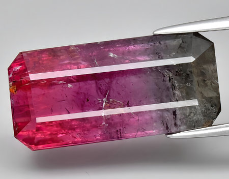natural bi color tourmaline gem on backgroundの写真素材