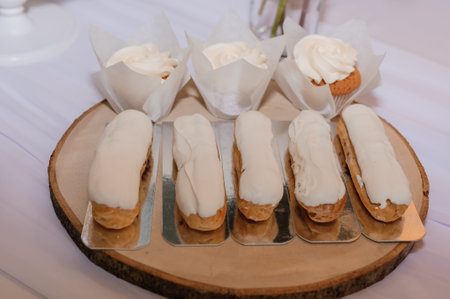 Sweet cakes at a wedding banquet. Catering, sweet festive buffet. Cookies, chocolate bar